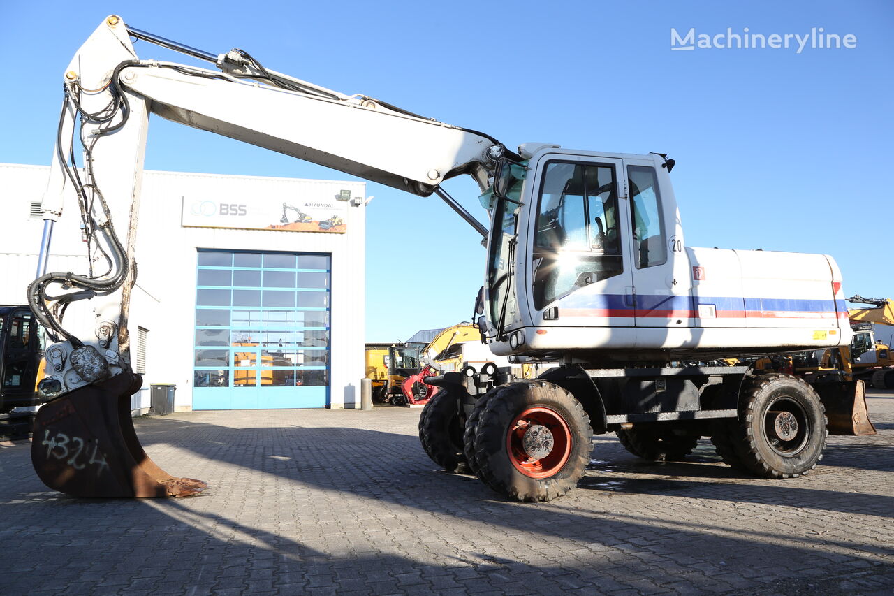 Caterpillar M318D excavadora de ruedas